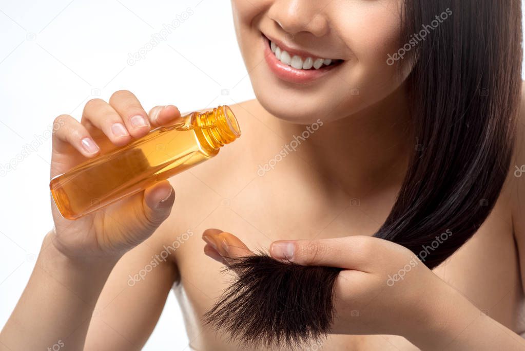 Therapist applying nourishing oil to skin.